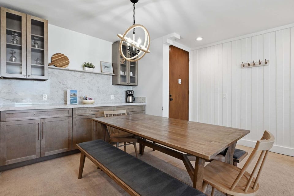 Gather around the large farmhouse-style dining table with comfortable seating for 6.