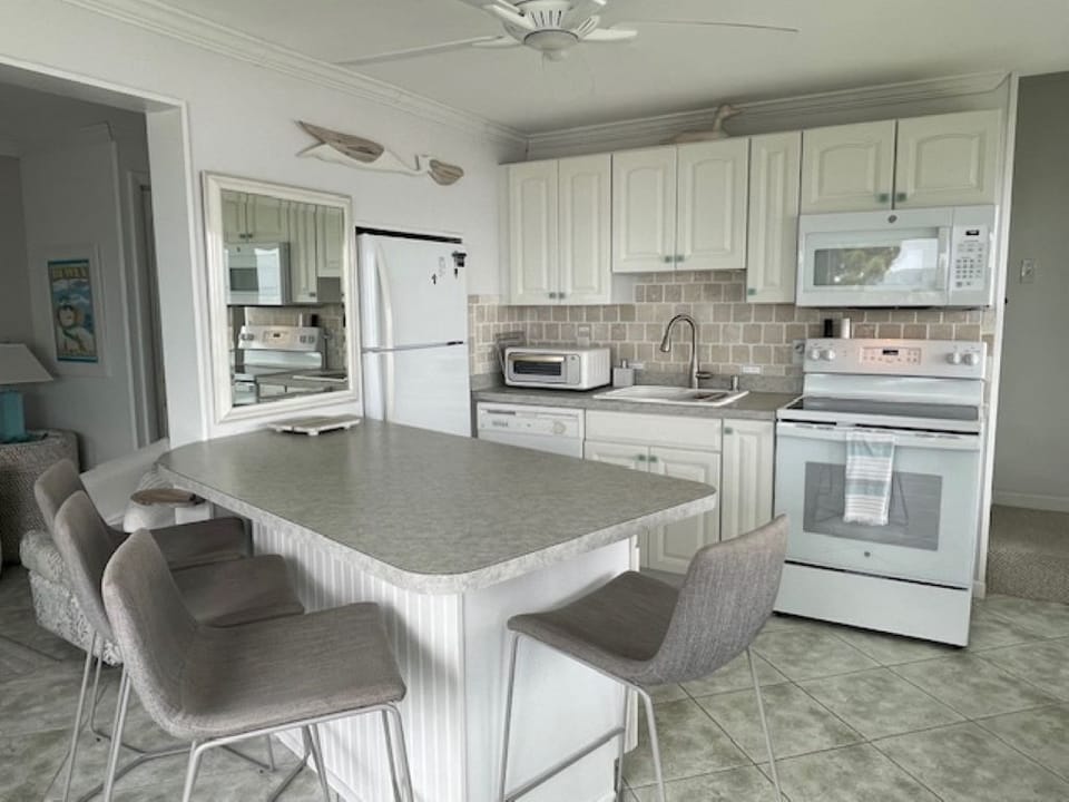 Fully equipped kitchen with new oven, microwave and air fryer.