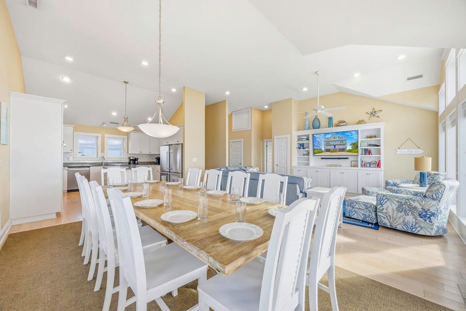 You'll love gathering around this spacious dining table for memorable meals, with the open kitchen and cozy living area creating perfect flow for entertaining.