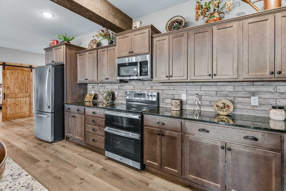 All stainless appliances, two refridgerators, two dishwashers, and all Cuisinart kitchen gadgets.