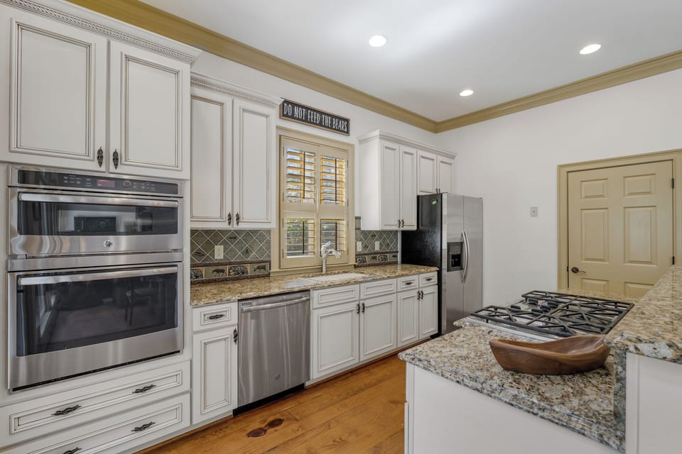 Kitchen with microwave, oven, gas cooktop, dishwasher