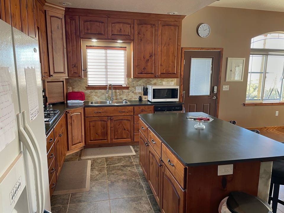 Kitchen, downstairs deck door, and dining room