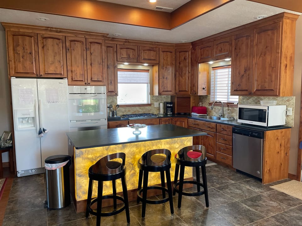 Kitchen with lit up island