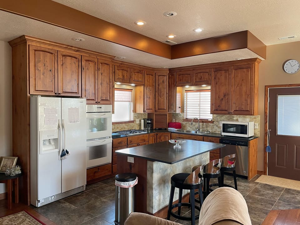 Kitchen with refrigerator, double oven, microwave, and dishwasher