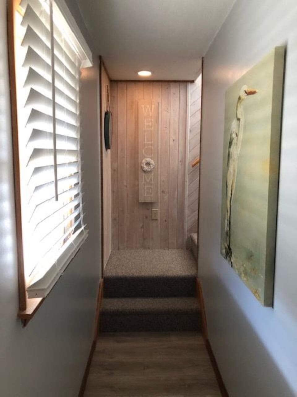 Hallway leading to stairway.