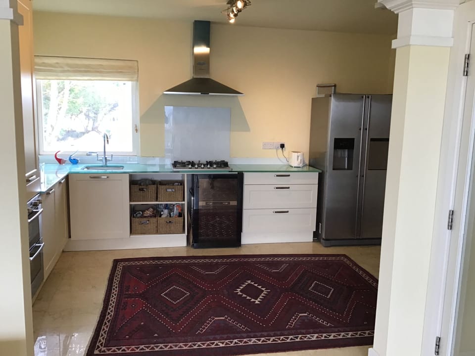 Kitchen, opens from dining area.