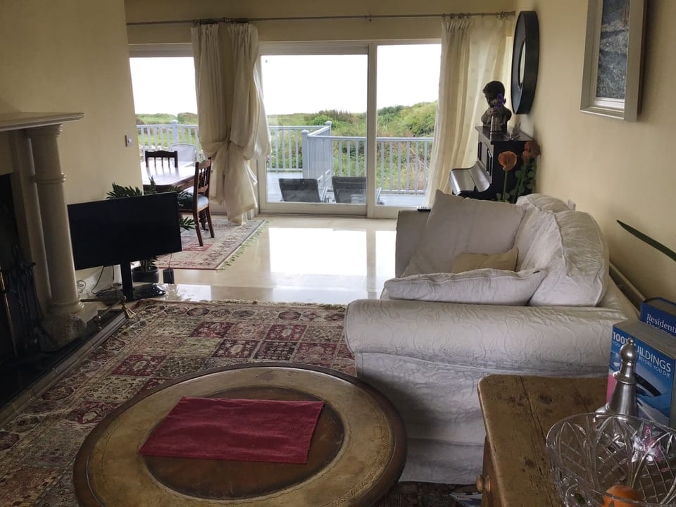 View from living room through dining to gardens and Ocean 