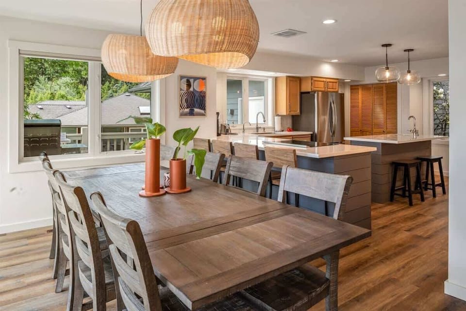 Large dining room with additional kitchen bar seating. 