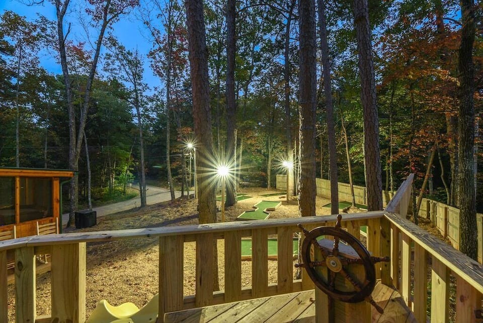 Watch the kids play at night from the hot tub on the screened in porch