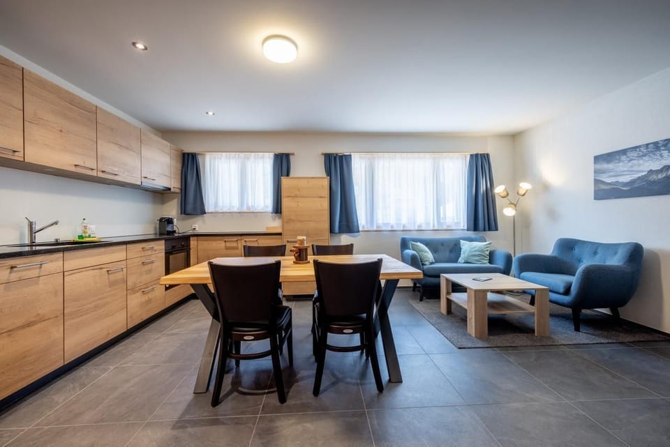 Well equipped new kitchen with dining table 