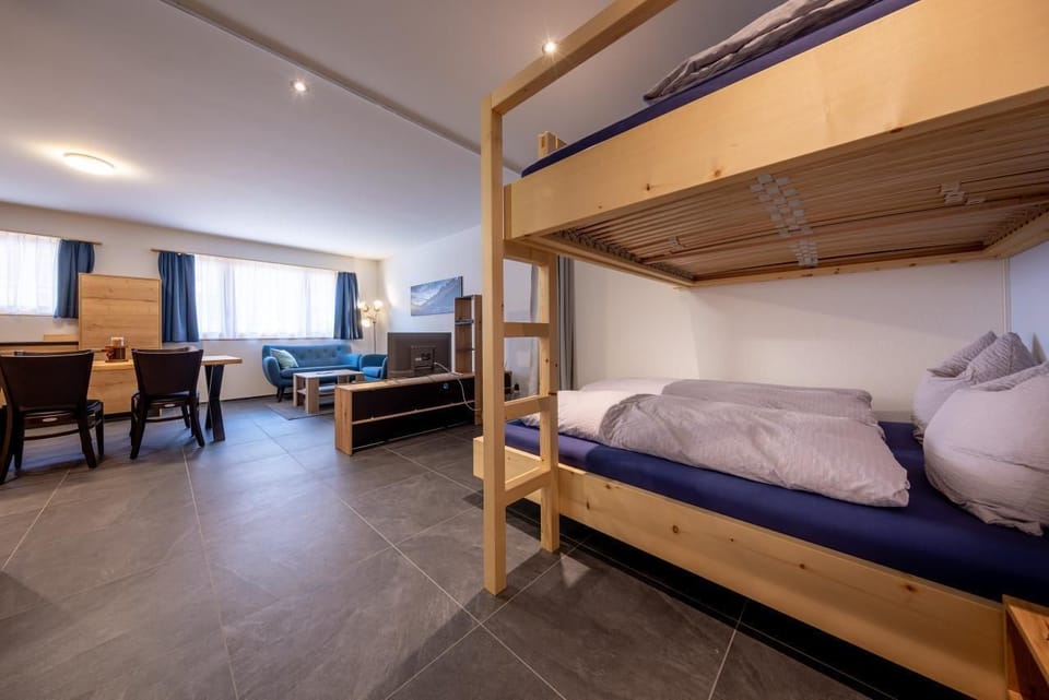 Two double beds one above the other with LED light strip 
