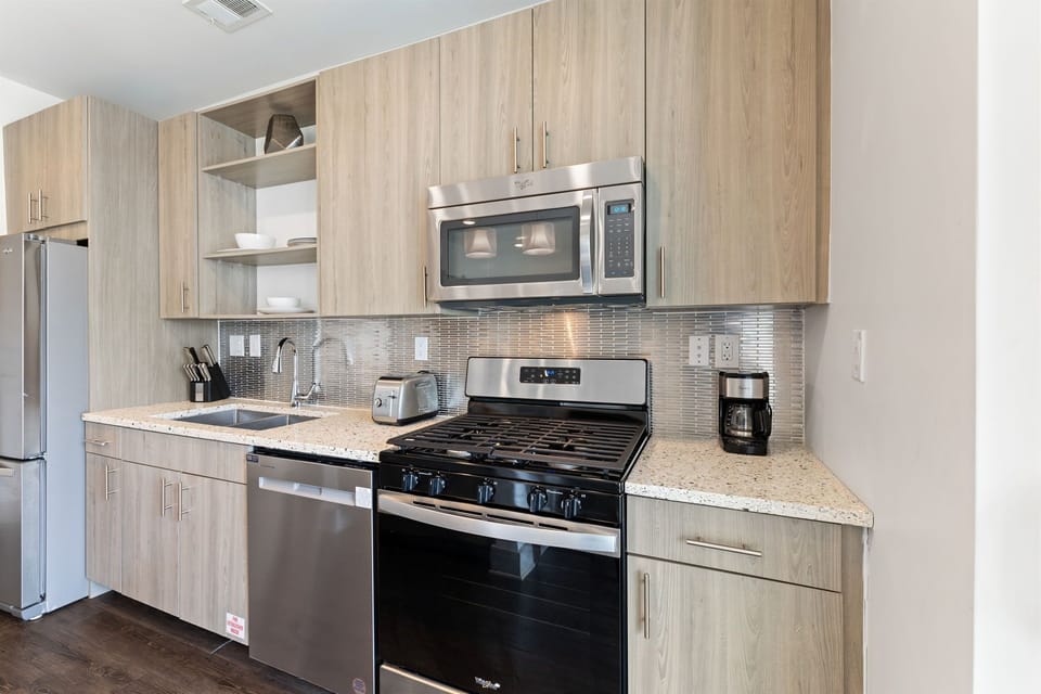 Well Equipped Kitchen with Stainless Steel Appliances