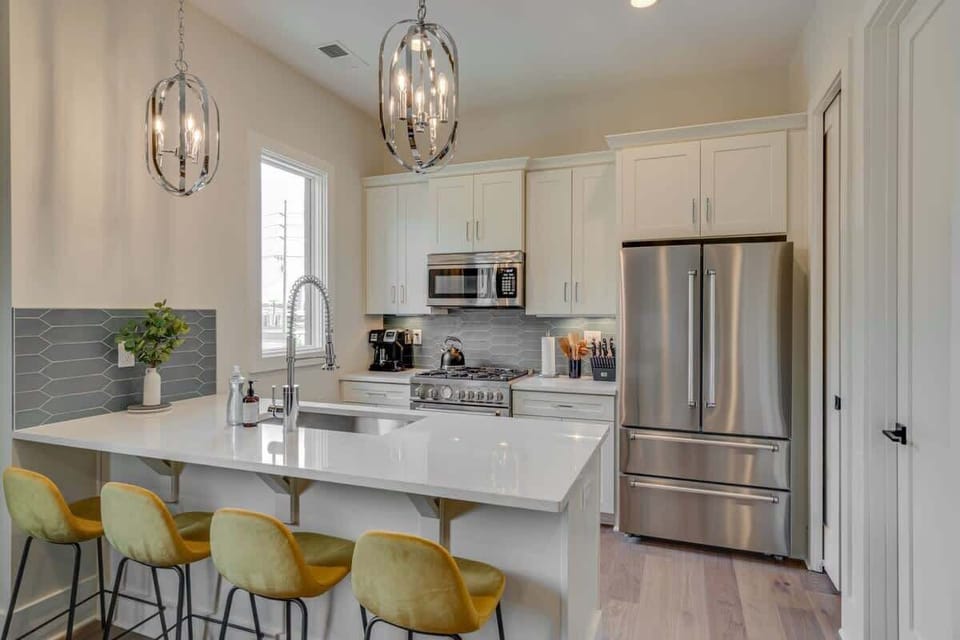 Easy conversation in the kitchen with bar stool offering the perfect spot for causal meals and morning coffee.