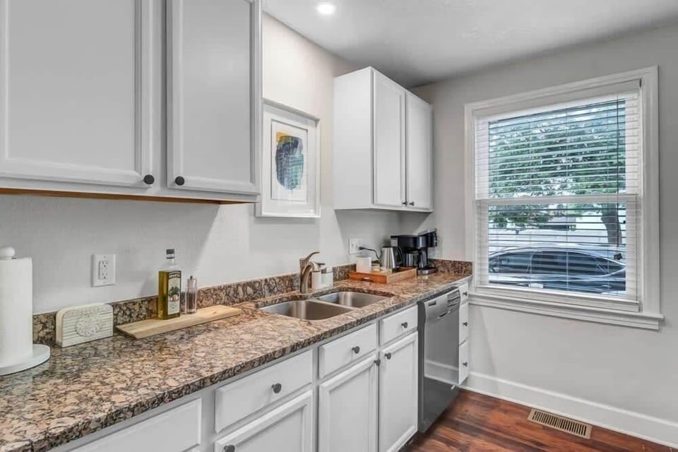 Newly renovated kitchen space with ample cooking utensils for a home-cooked meal.