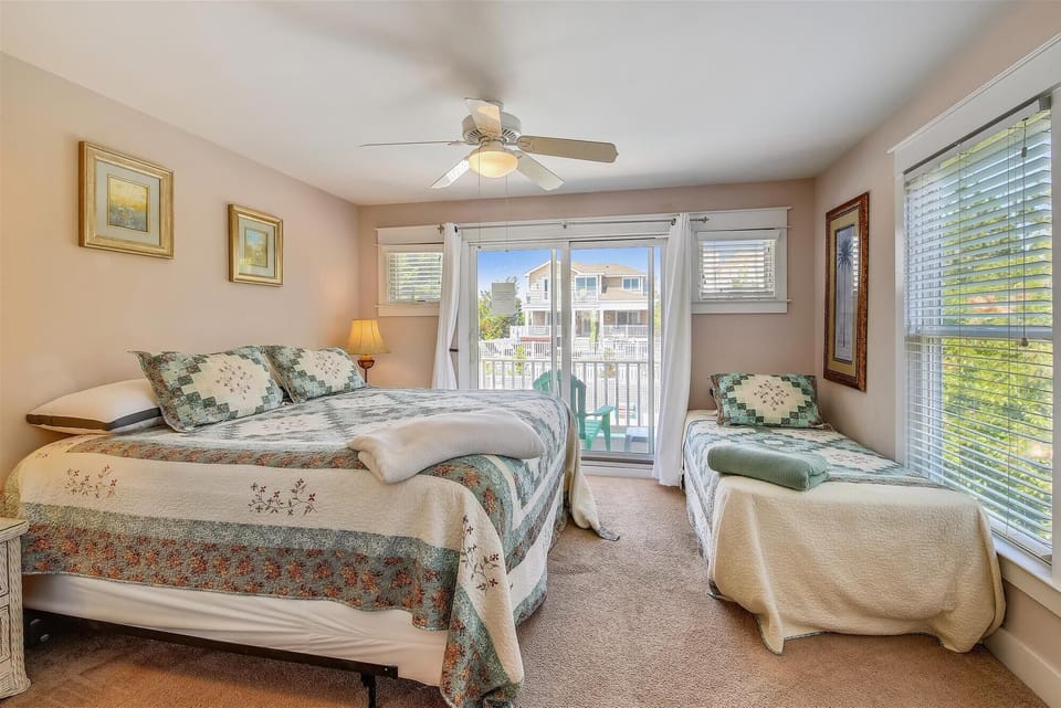 Wake up to soft natural light and lovely views from your cozy bedroom, featuring comfortable beds and a private balcony where you can sip your morning coffee and breathe in the fresh air.