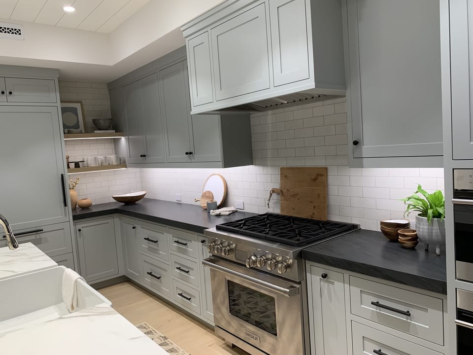 Kitchen with Wolf range and steam oven and microwave. Built-in refrigerator.