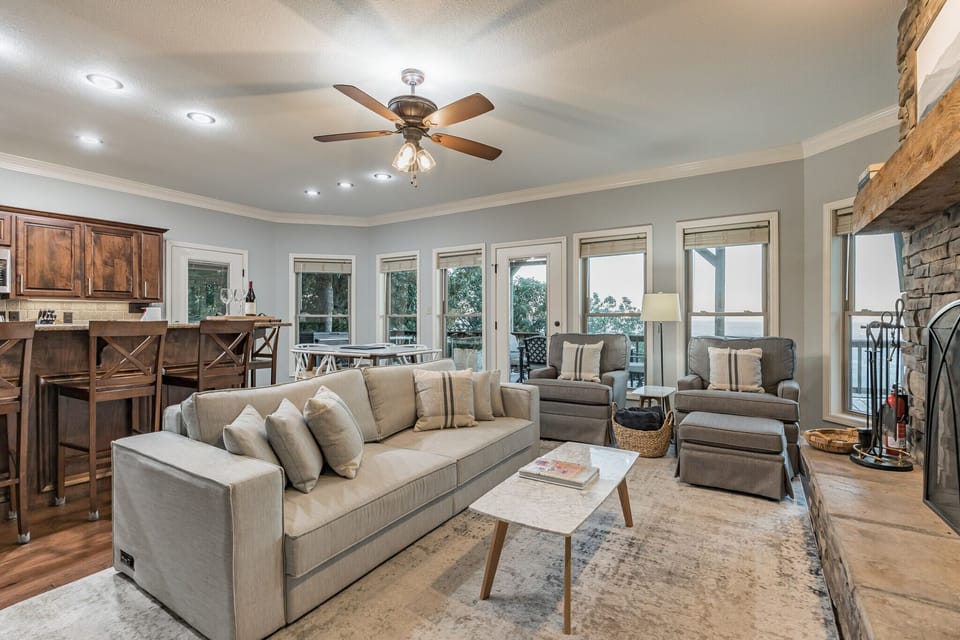 Main living room with kitchen, fireplace and convertible bed. Mt Nebo State Park