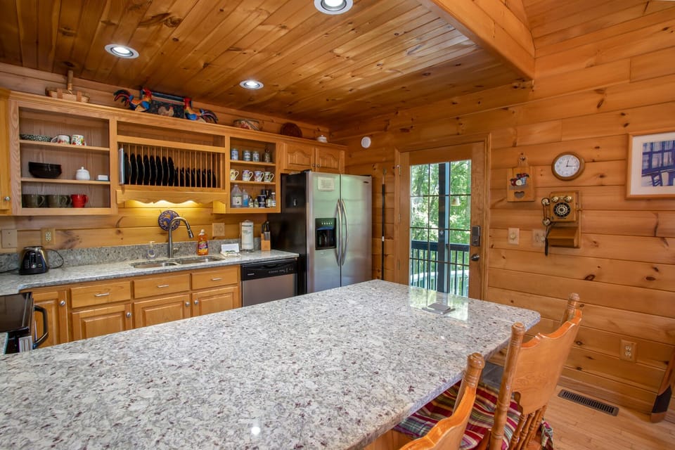 Kitchen with Large Bar Top and Bar Stool Seating