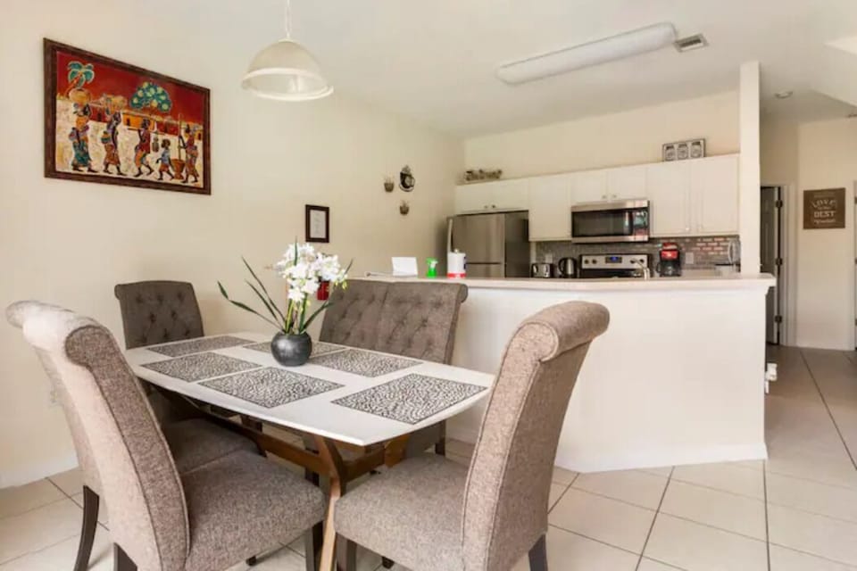 Dining area with kitchen in the background