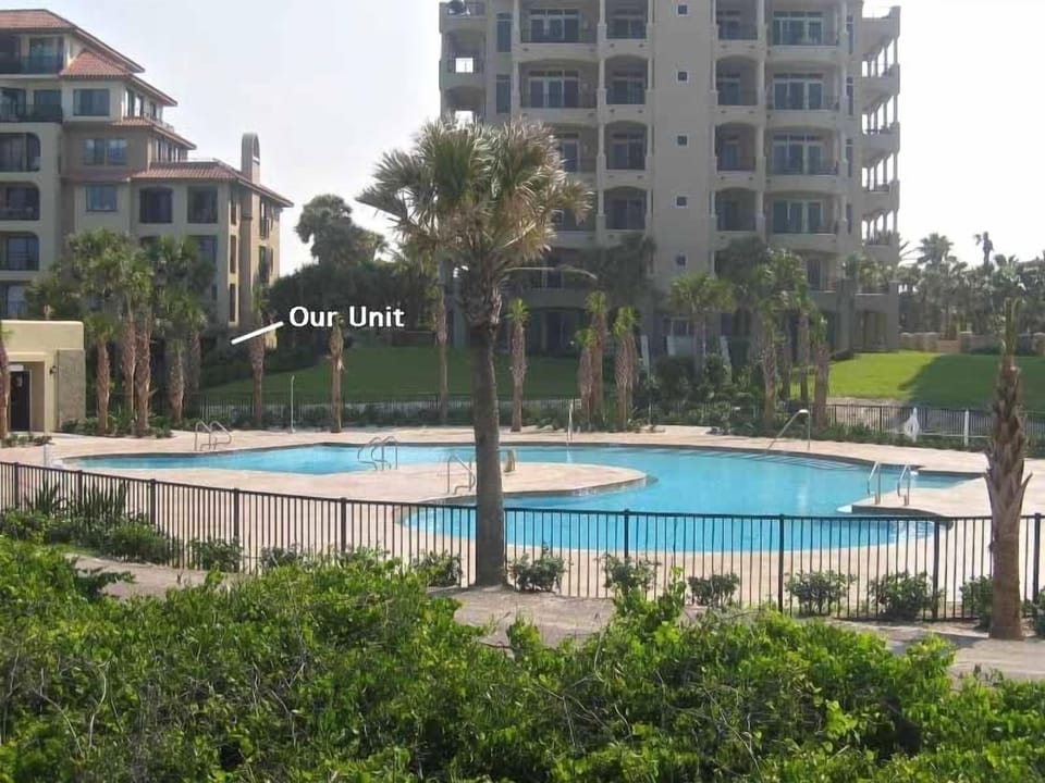 Pool just a few steps from patio.   