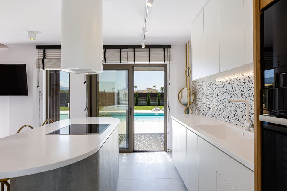 Kitchen has branded appliances and island to cook as a family