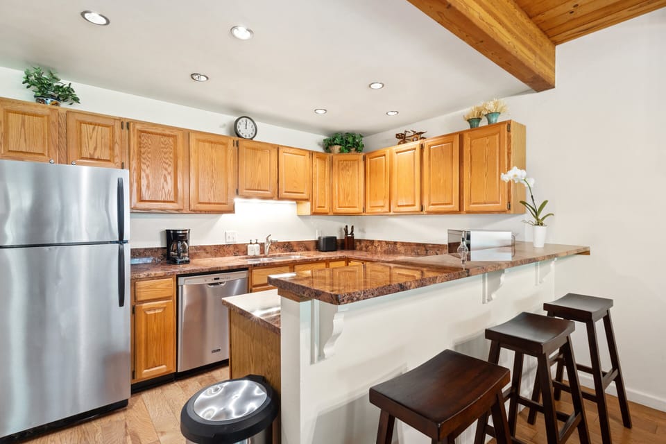 The kitchen is open plan with the living room and is well equipped for cooking family meals.