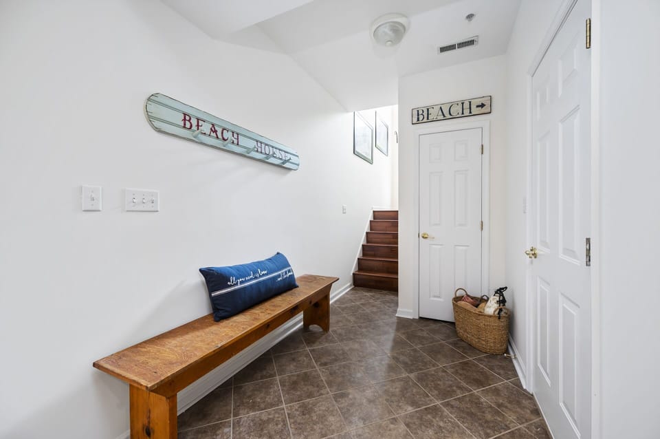 Entrance to lower level living area with 2 bedrooms and full bath