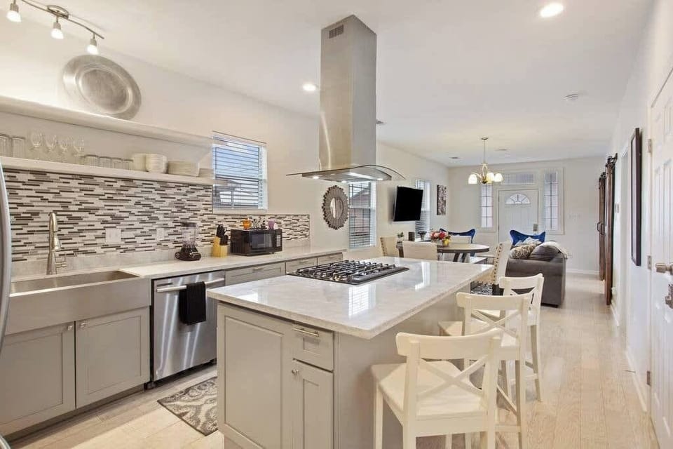 Spacious kitchen with generous counter space and seating—perfect for prepping meals together or gathering around the island.
