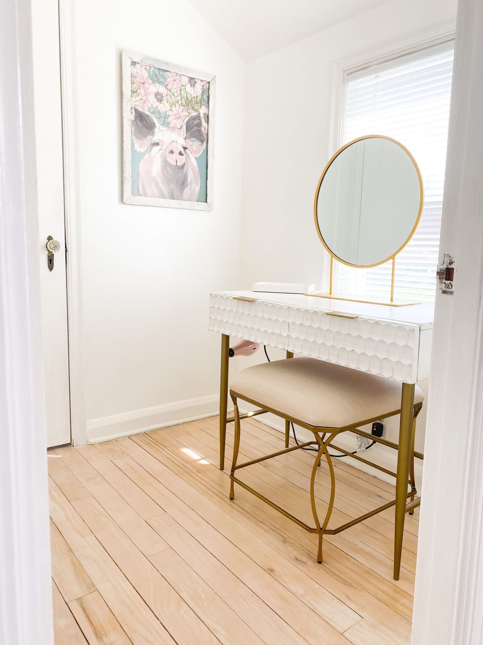Vanity, mirror, hair dryer. Small room to do makeup and get ready