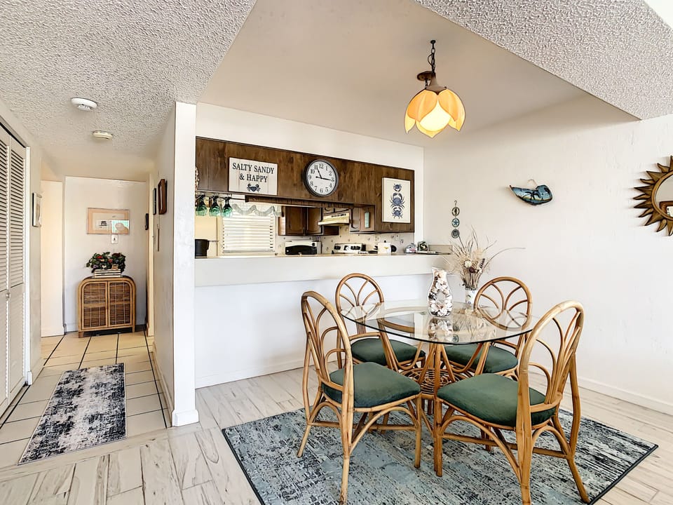 Dining room with view into kitchen through a pass-through