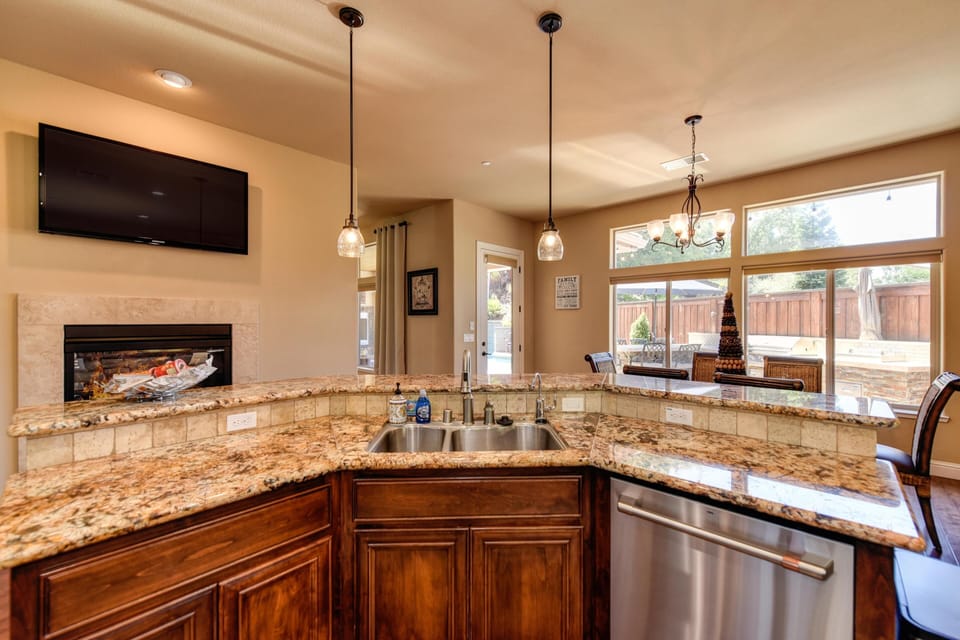 Reverse osmosis filtered water dispenser to the right of the faucet