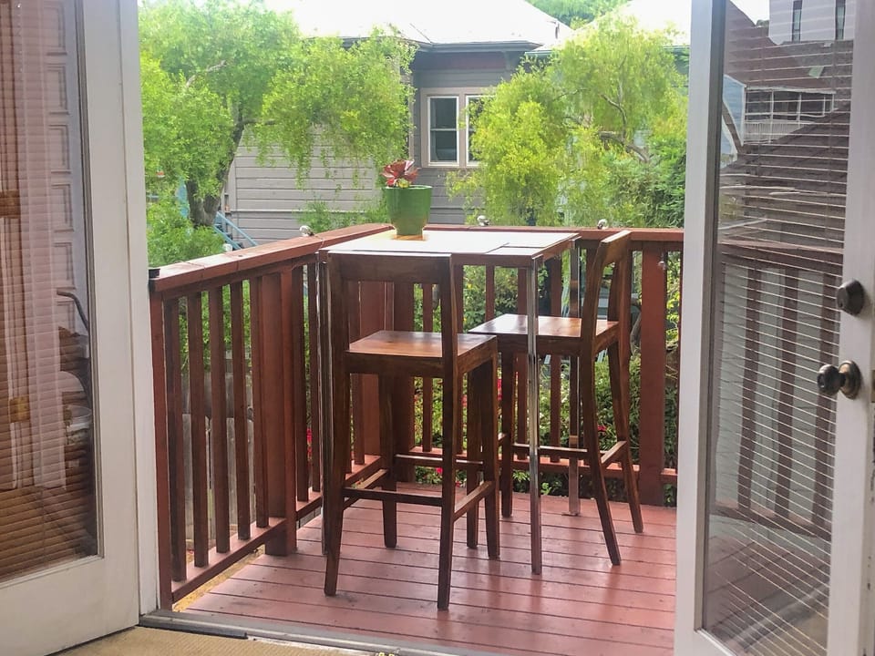 Deck off the back bedroom. Furniture has been changed. There is seating for 2.