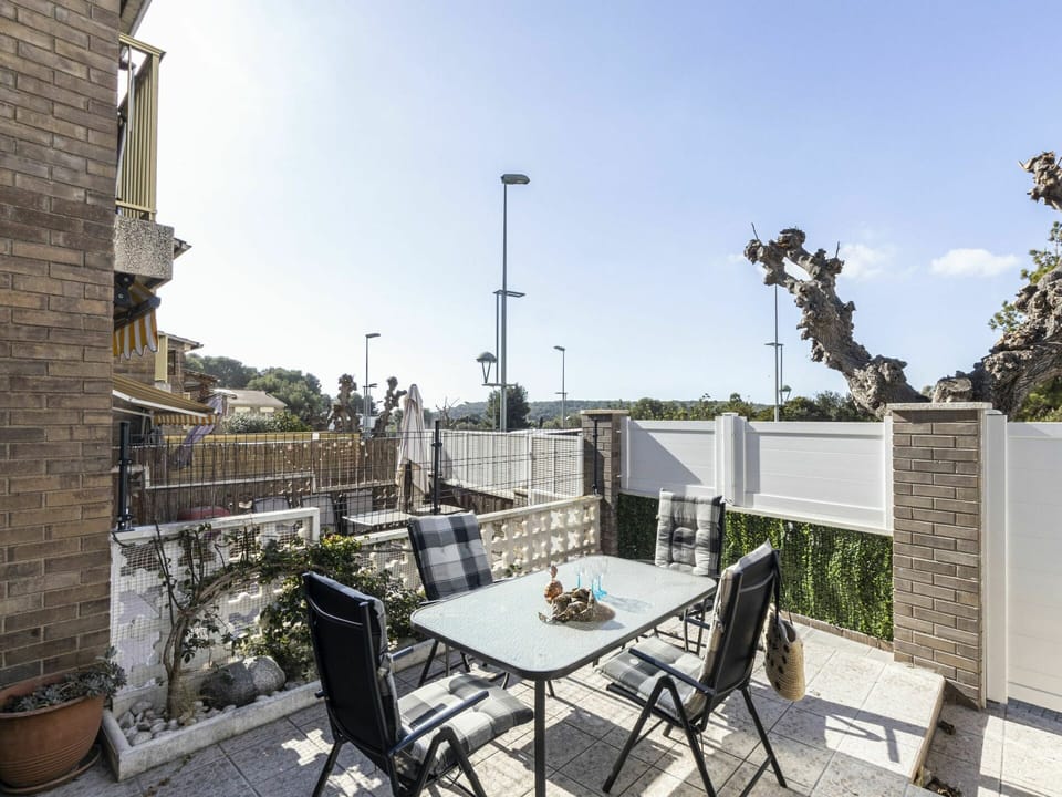 Sky, Property, Table, Furniture, Building, Flowerpot, Chair, Plant, Outdoor Table, Outdoor Furniture