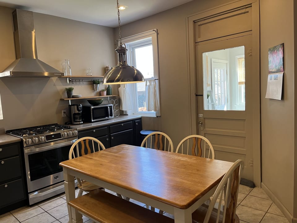 Kitchen view to sunroom table for 6.