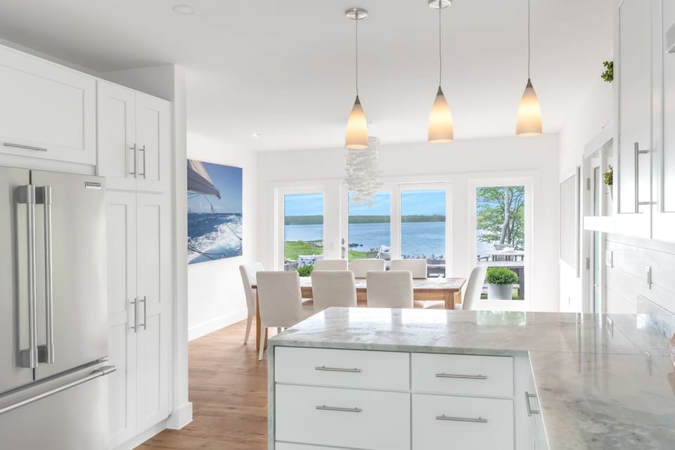 Kitchen towards dining area with bay views and large built-in refrigerator