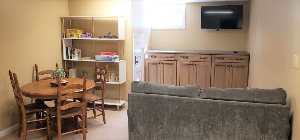 Family Room with TV, Games, Books and a second table. 