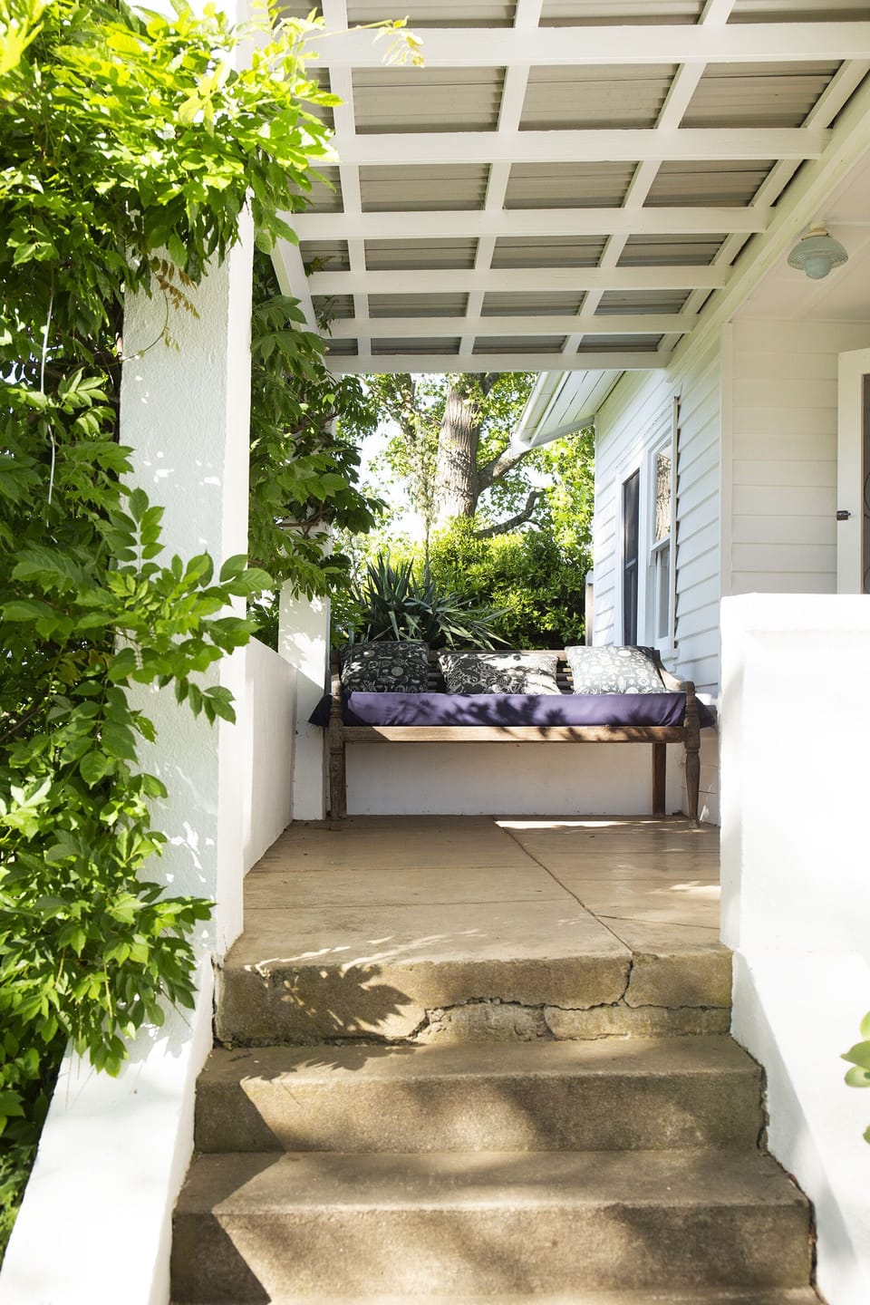 Wisteria frames the verandah to Harvest House.