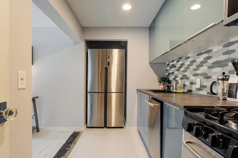 Full size fridge + freezer, small dishwasher, and gas range + oven will make meal time a delight.