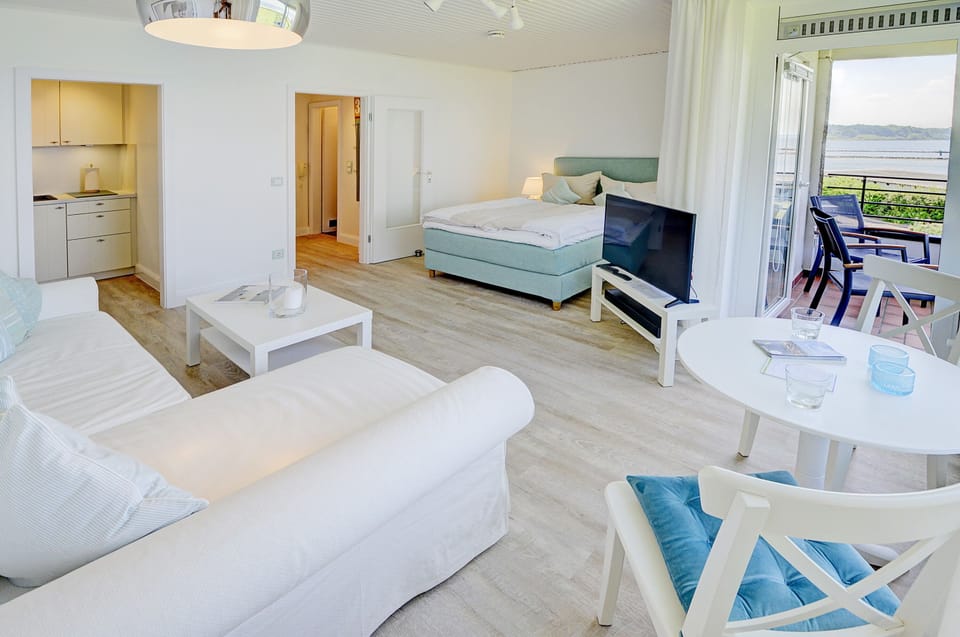 bright living area with access to the balcony