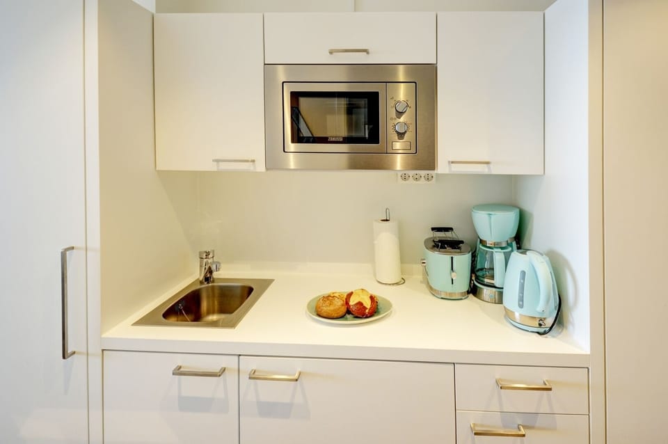open kitchen with dining area and access to the living room
