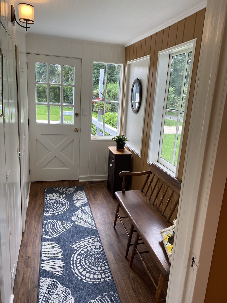 Back entrance hallway:  laundry rm + 1/2 bathroom, big deck + driveway in back
