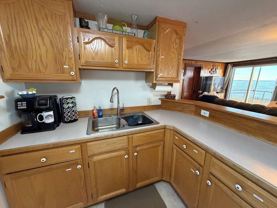 Kitchen with breakfast bar and water views.