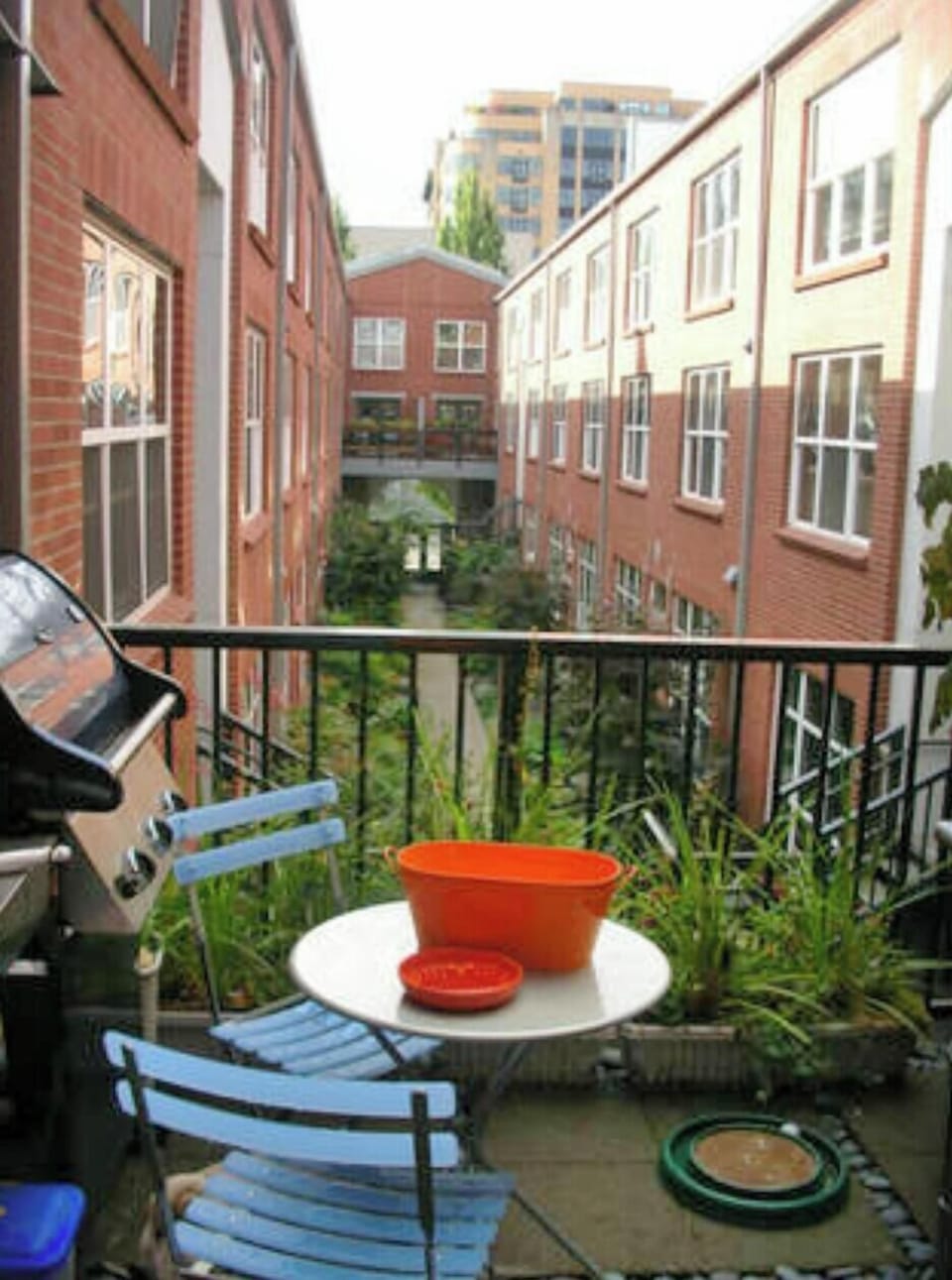 Patio with BBQ and bistro table.