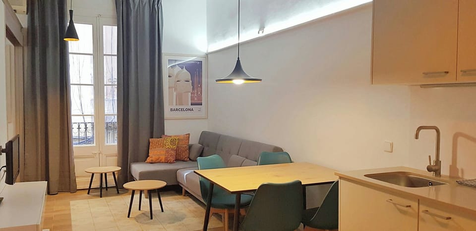 Enjoy a meal or relax in the open-plan living area, featuring a Smart TV and air conditioning for both warm and cold months.