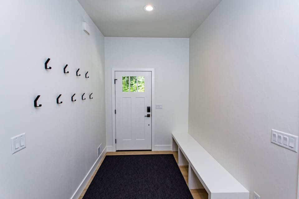 Large entryway with places for all your gear