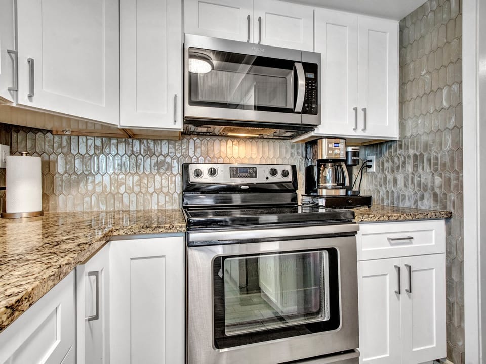 Electric range with oven, microwave, drip coffee maker and Keurig coffee maker