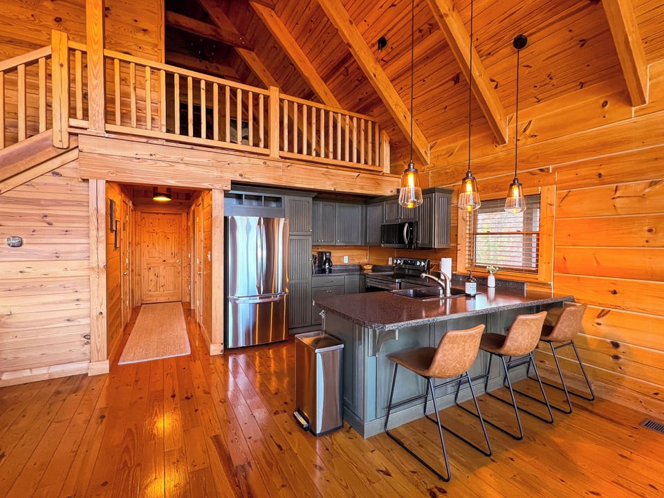 Kitchen with new stainless steel appliances.
