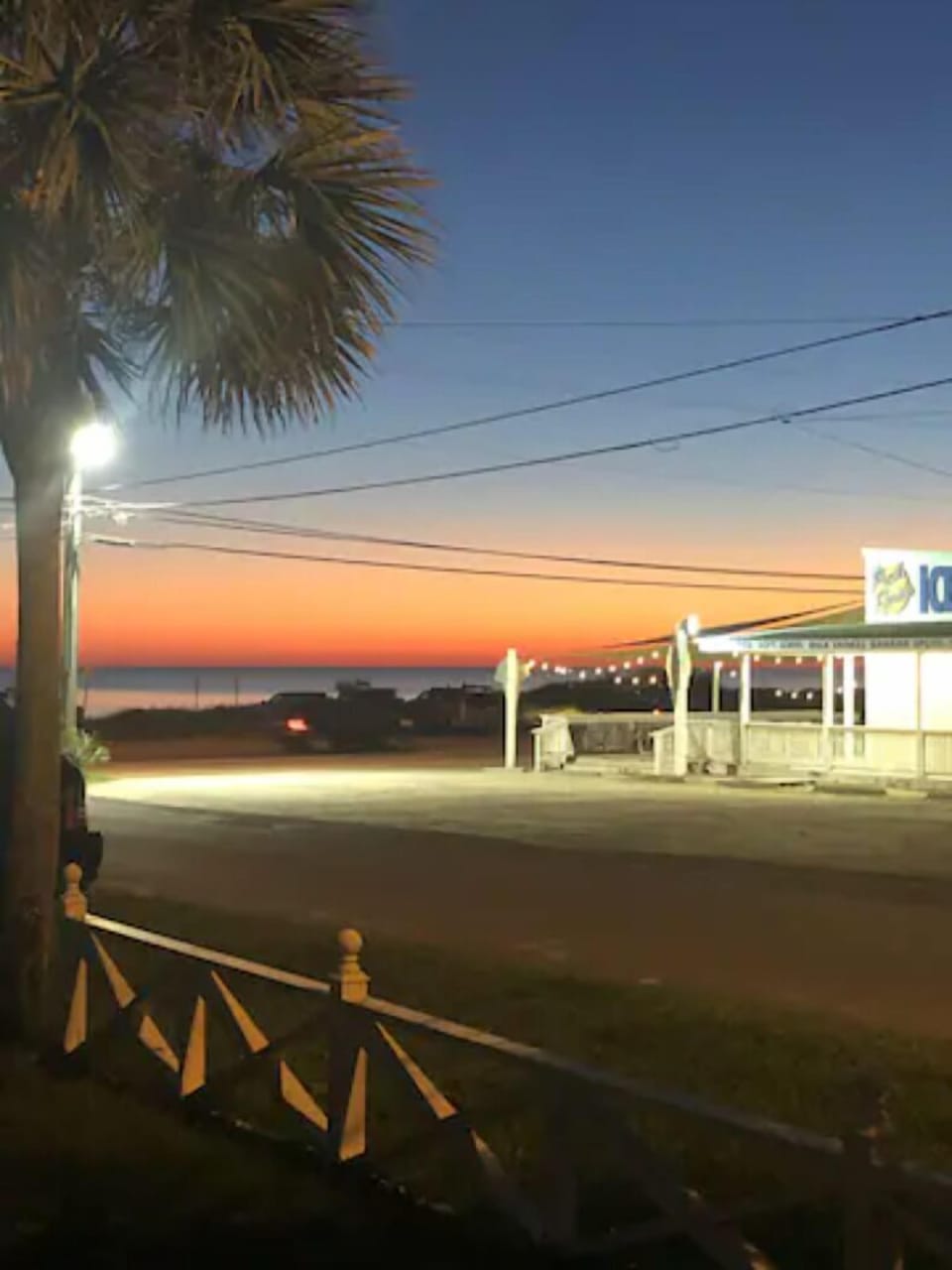Sunset view from beach house-walk across street and you're at the Beach!