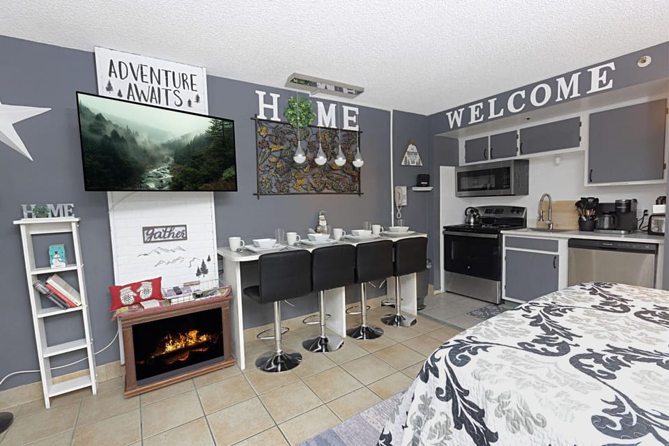 Kick back and enjoy the warm, electric fireplace and the 48" smart TV.