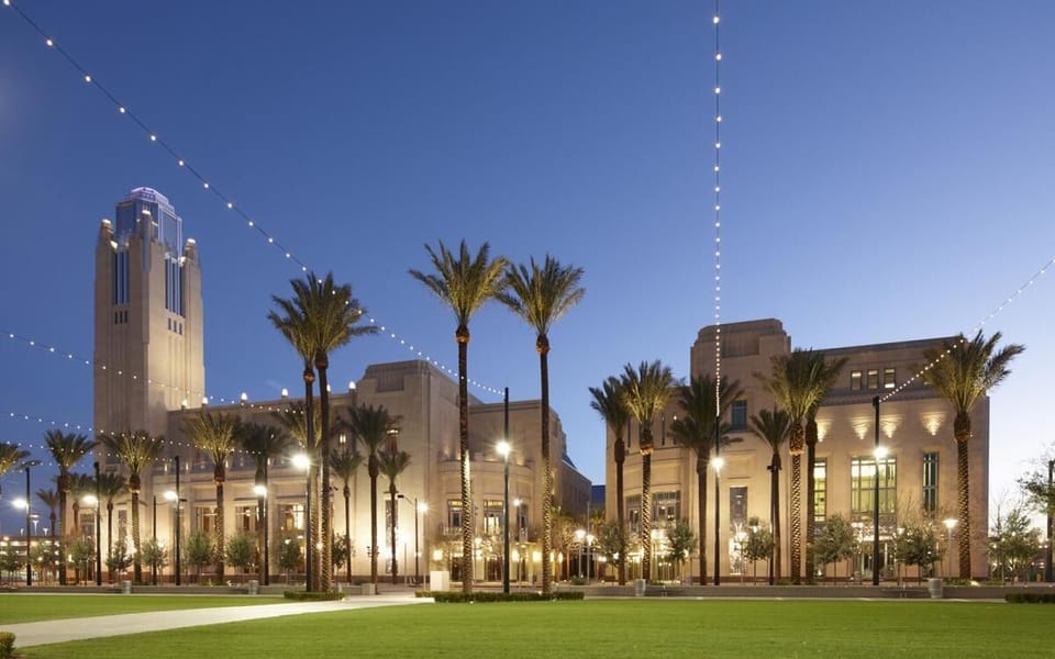 Arrive at a glowing resort promenade under twinkling lights.